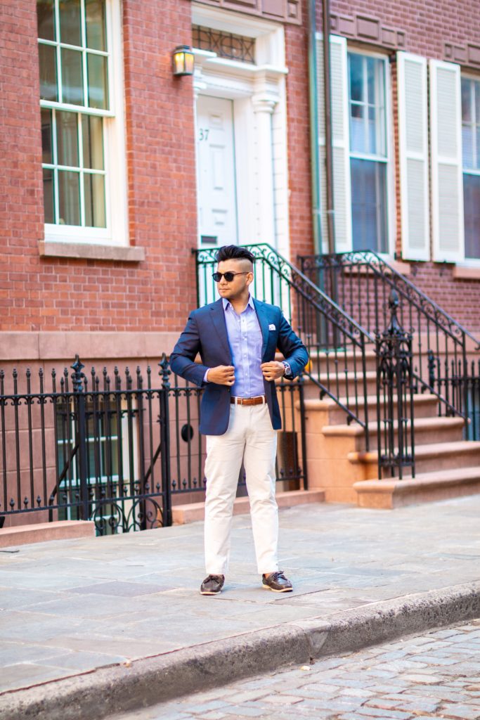 wearing white pants chinos  with navy blue blazer and boat shoes dandy in the bronx