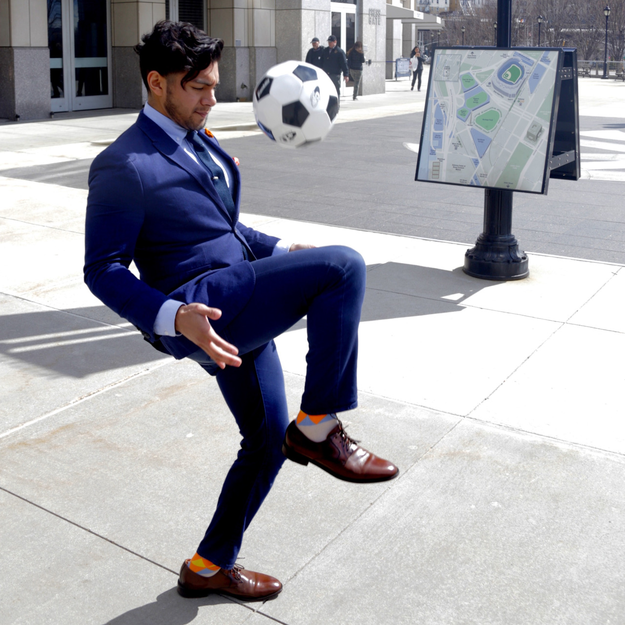 menswear suit inspired by nycfc navy suit - dandy in the bronx playing soccer in a suit