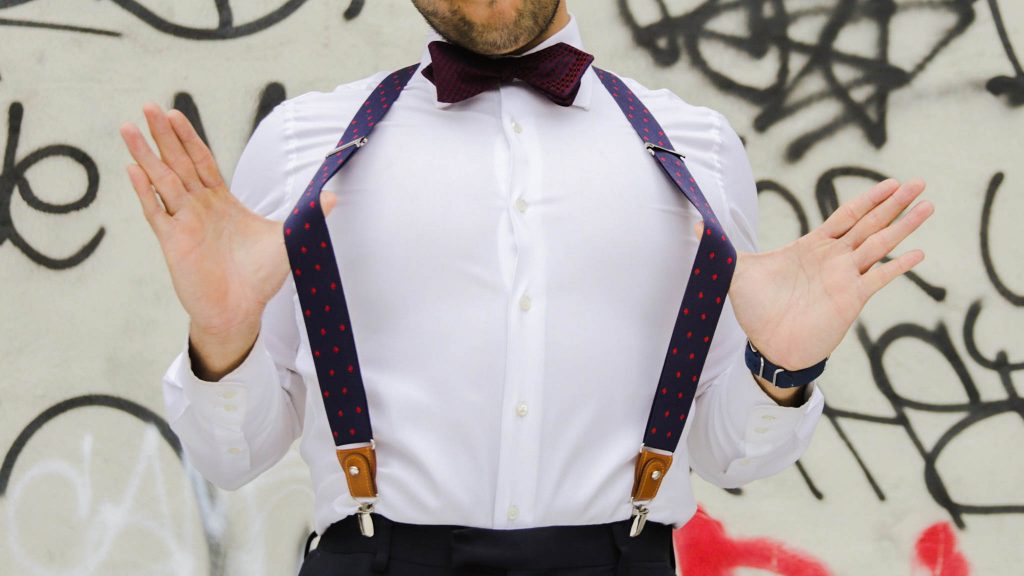 man with suspenders - man with bracers - man with shirt that doesn’t fit - muscular man with shirt that doesn’t fit - ill fitting shirt - white shirt - man with bow tie - bow tie and shirt - dandy in the bronx