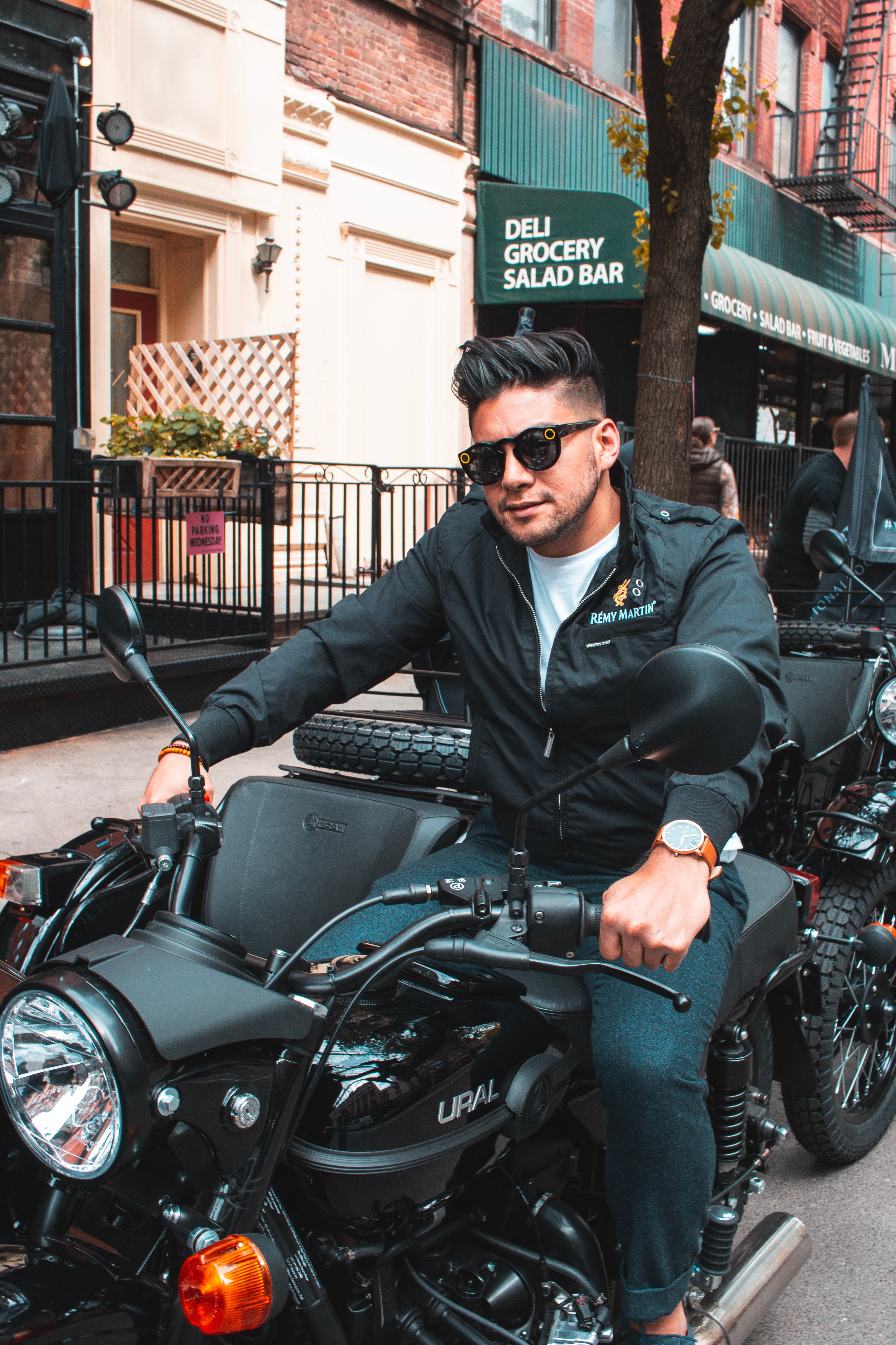 Complete Guide To Insuring Your Motorbike - man riding a motorcycle with side car - dandy in the bronx