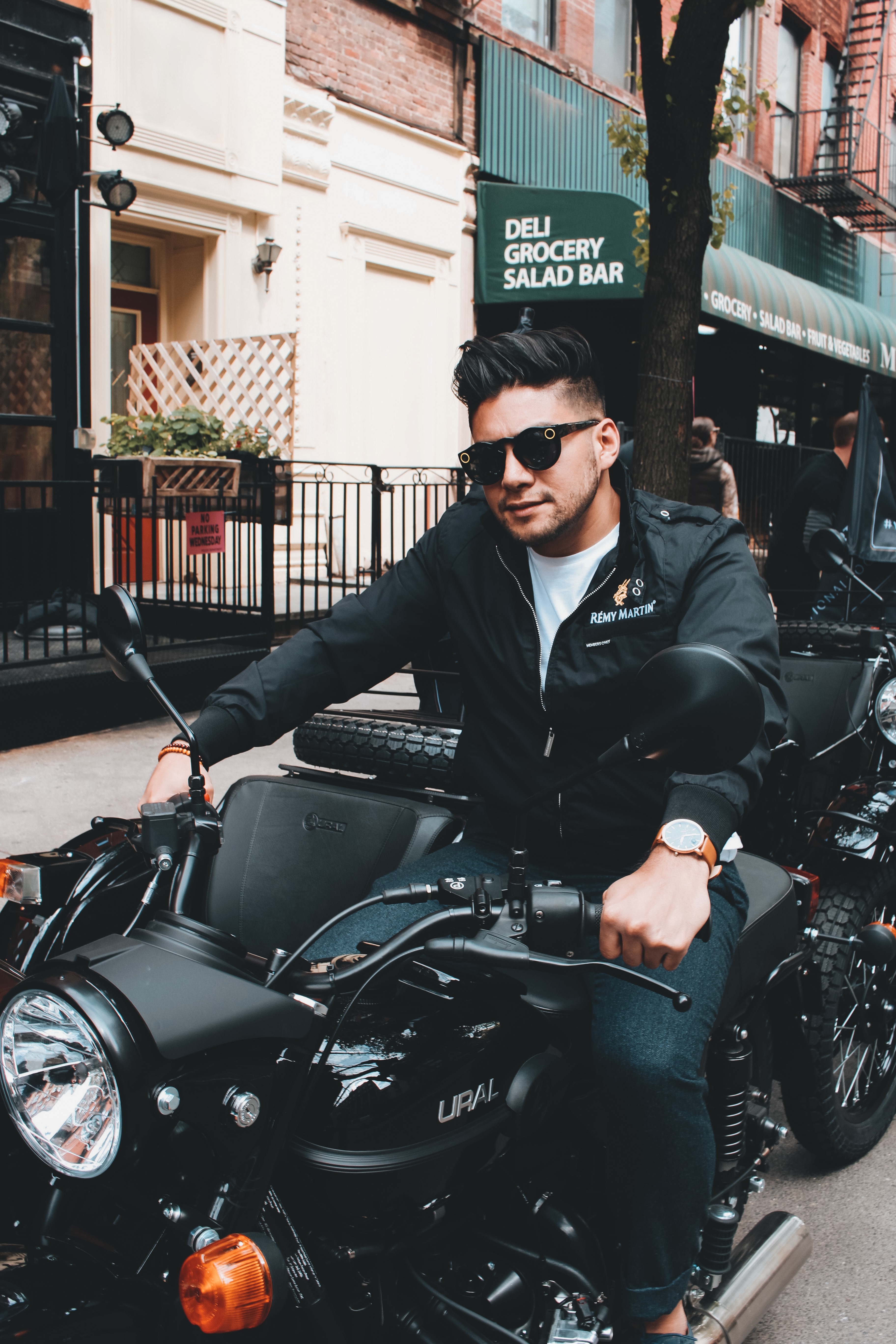 2 Or 4 Wheels? Choosing Between Cars And Motorcycles - dandy in the bronx - man wearing jacket on a motorcycle 
