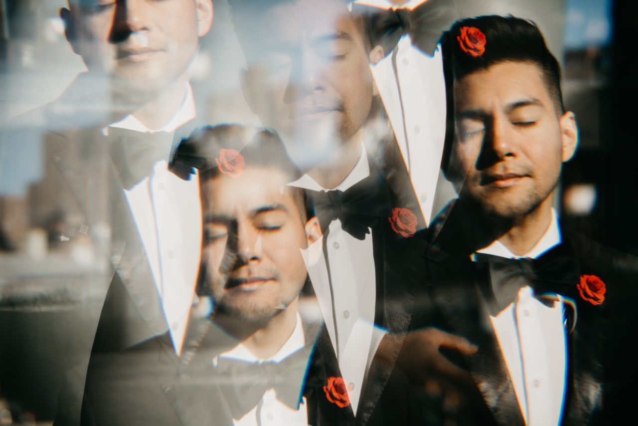 4 WAYS TO KEEP YOUR LIFE IN ORDER DURING UNCERTAIN TIMES - photo by hellojasminephotos - dandy in the Bronx - tuxedo - red lapel pin - black bow tie