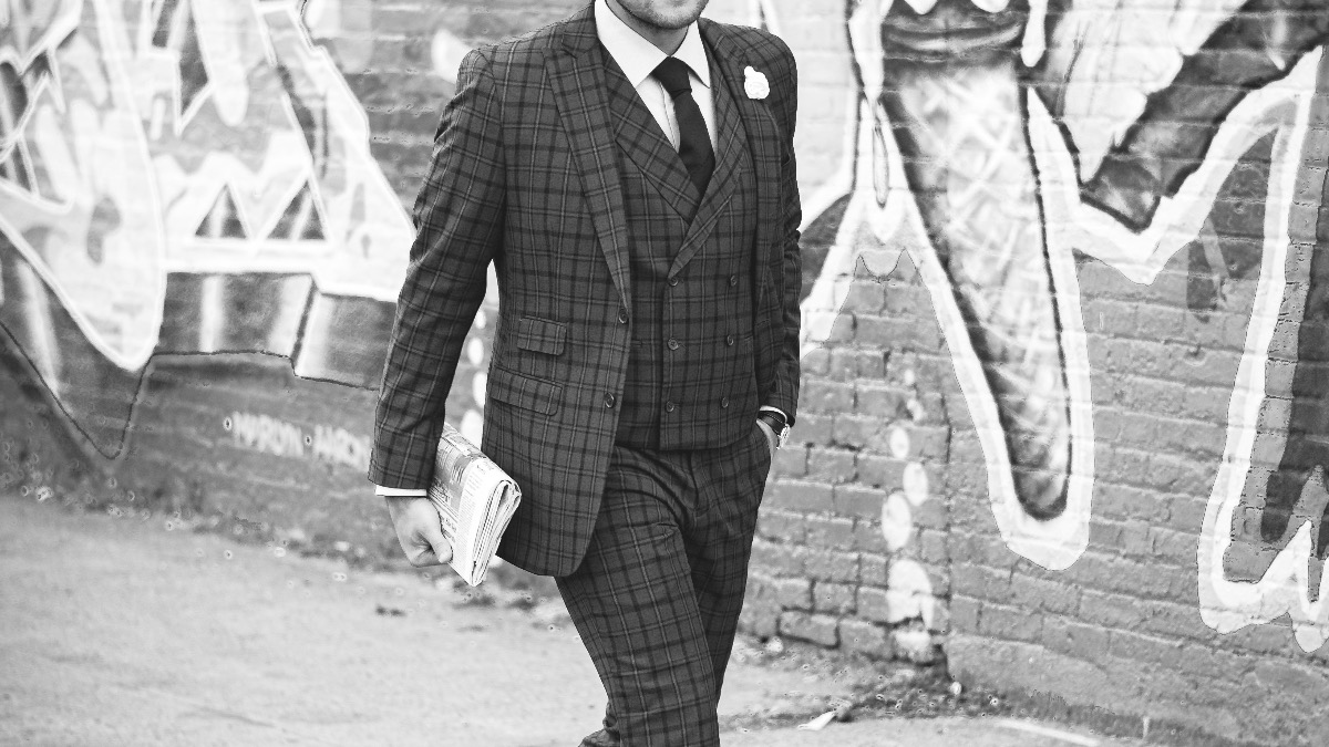 4 CHANGES THAT CAN MAKE YOU LOOK MUCH MORE PROFESSIONAL - dandy in the bronx - black and white photo - man in suit -