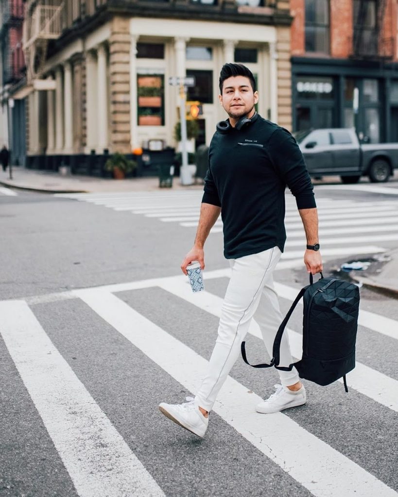 white joggers and black pull over - dandy in the bronx - black book bag