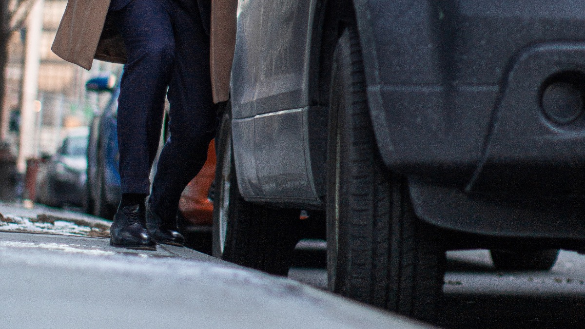 man looking at tires