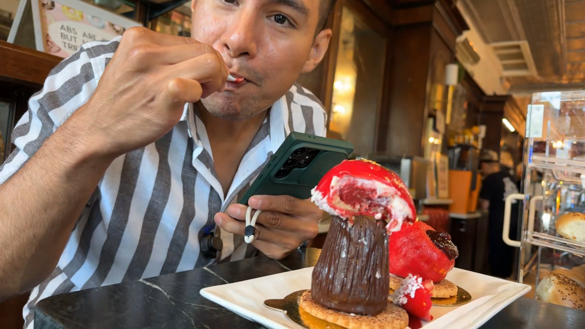 Diego Leon tasting the viral mushroom pastry at Conti's Pastry Shoppe