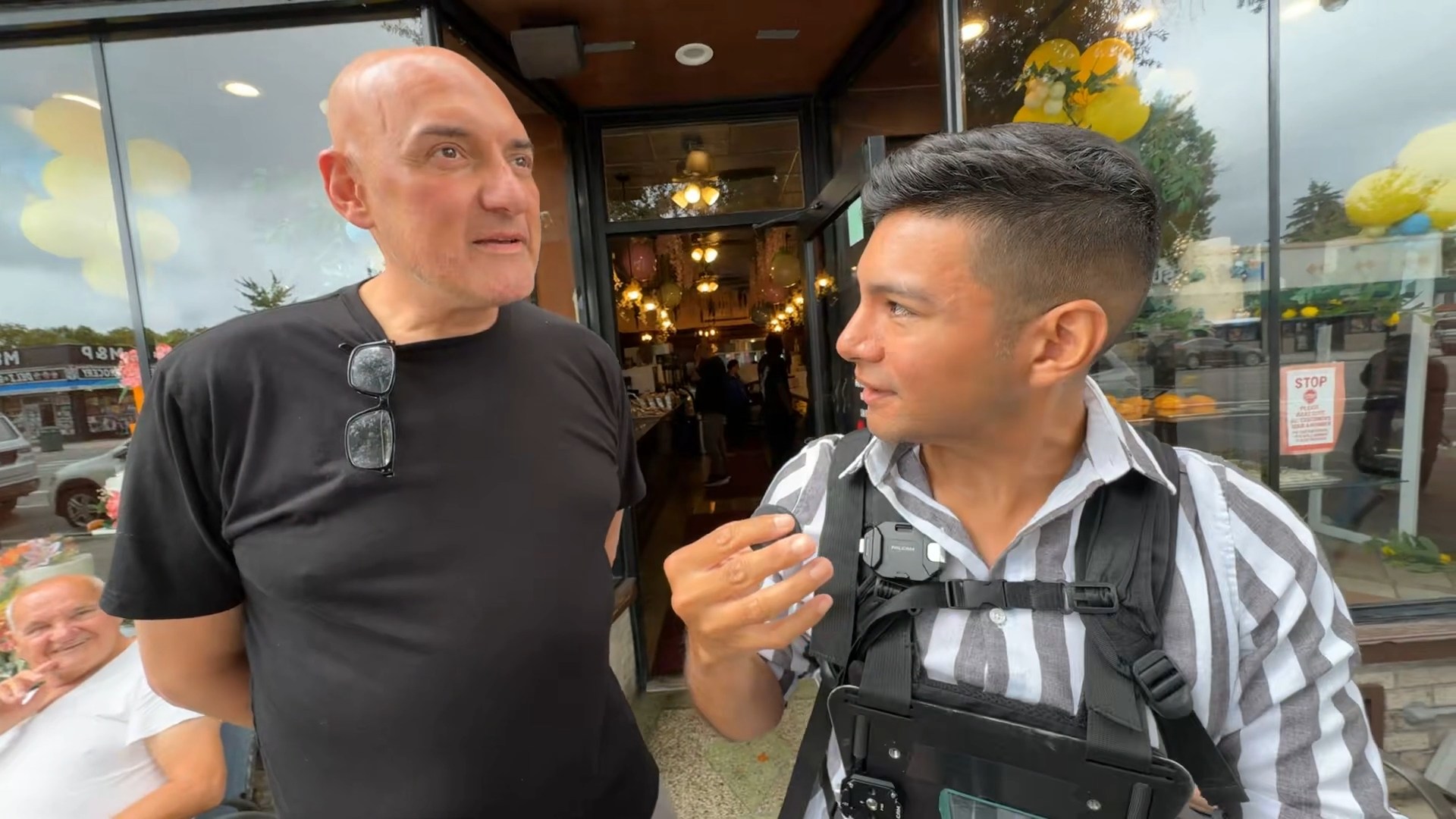 Diego Leon chatting with Conti's Pastry Shoppe owner Safet Paljevic