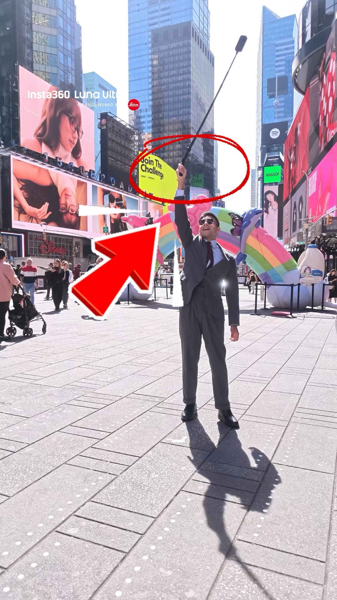 Diego Leon swinging the Insta360 bullet time selfie stick overhead in Times Square