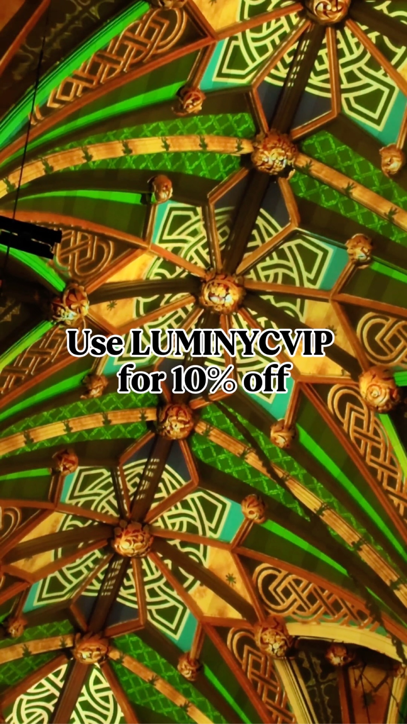 Graphic reading Use LUMINYCVIP for 10 percent off over green Celtic-pattern LUMINISCENCE projections at St. Patrick's Cathedral